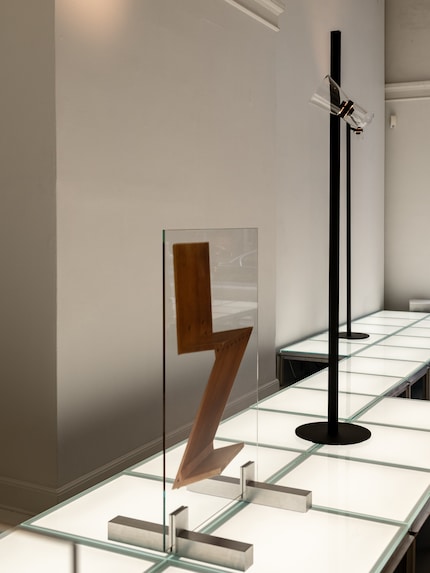 The Zig Zag chair remains a flat image behind glass, next to the floor version of Nocturne.